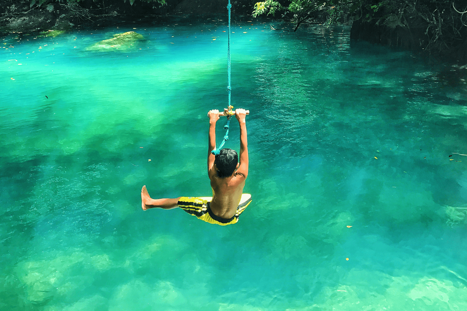 PDC in Travel Medicine - boy swinging over water